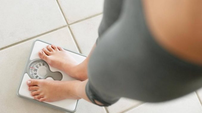 woman-on-weighing-scales